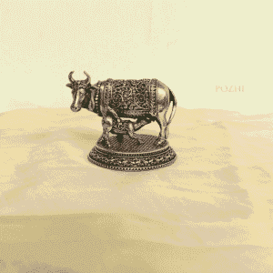 Front view of Antique Brass Cow Idol – 2 inch handcrafted statue