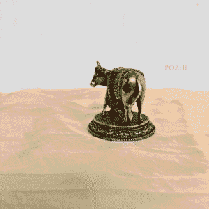 Side view of Handcrafted Brass Cow Idol – 2.3 inch width